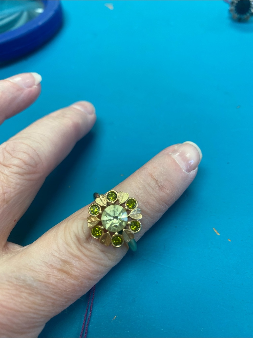 Vintage Avon  Floral Ring with Green Gem Accents. Size 6